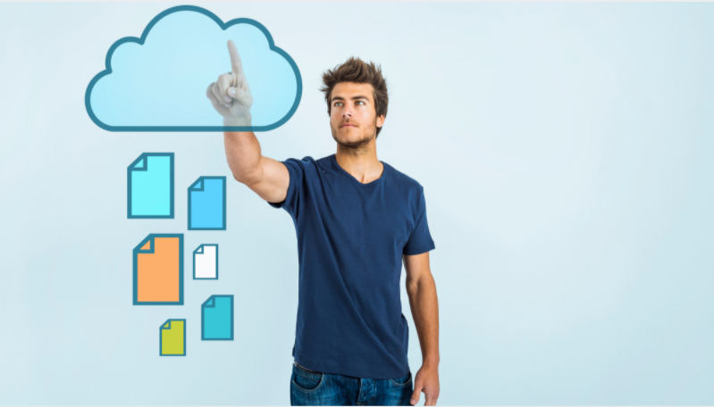 a man pointing an animated cloud based storage with files logo in the  background