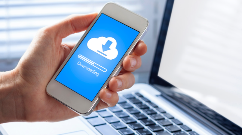 man holding white iphone and downloading something - cloud storage for video editing